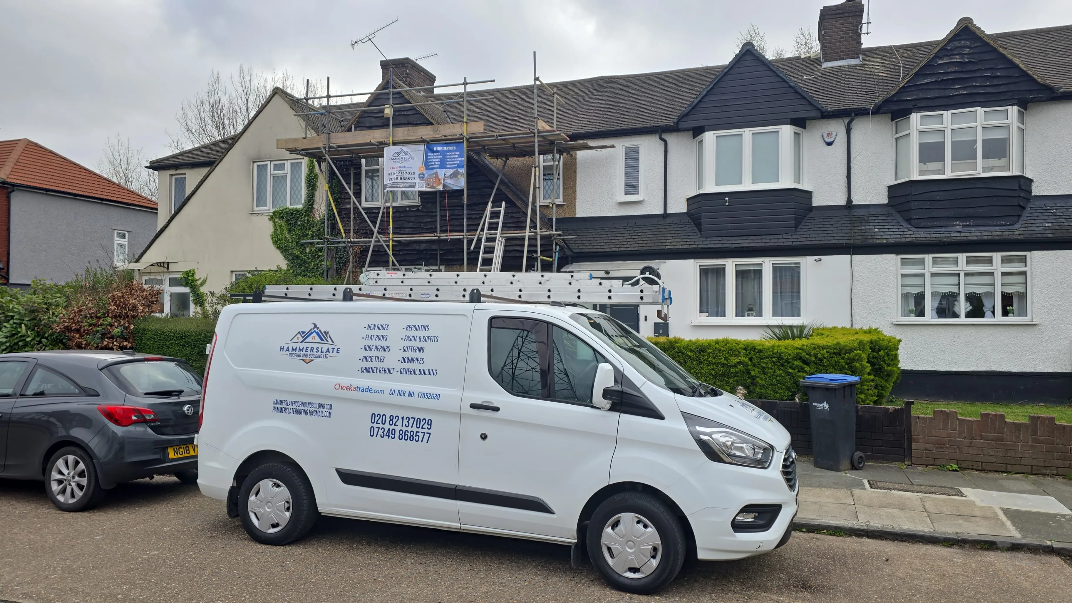 Reigate Roofing branded van parked outside a Surrey property under repair